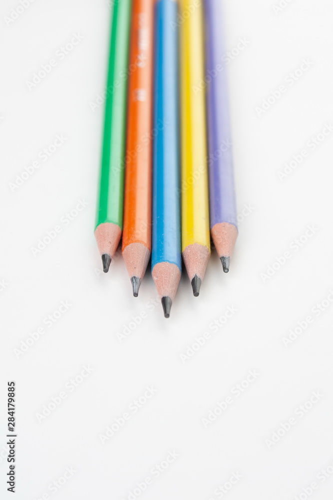 colored pencils in the shape of a star on a white background colored pencils in the shape of a star on a white background