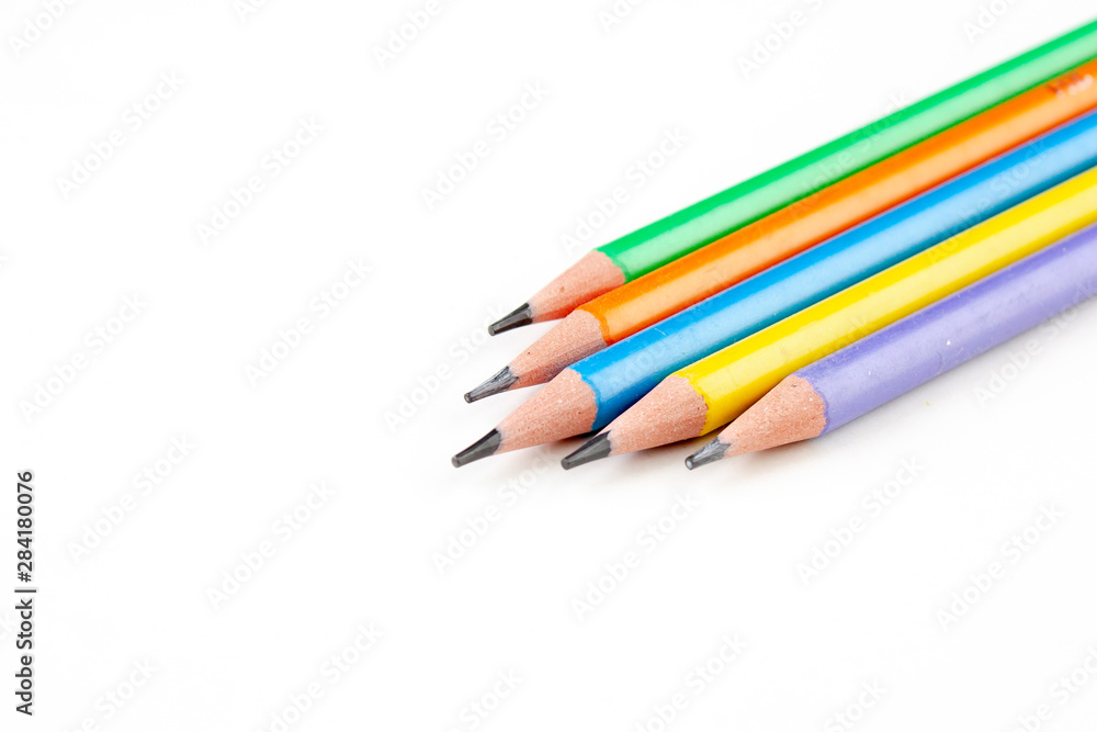 colored pencils in the shape of a star on a white background