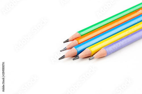 colored pencils in the shape of a star on a white background