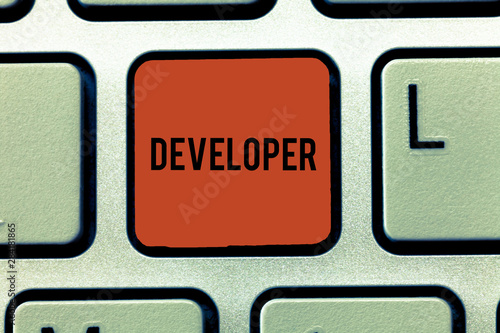 Word writing text Developer. Business concept for demonstrating or thing that develops grows or matures something Keyboard key Intention to create computer message, pressing keypad idea photo