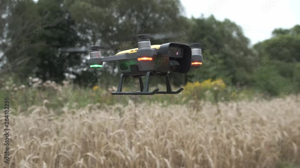 Quadcopter drone close-up flying above the ground. Quadcopter drone close-up flying above the ground.