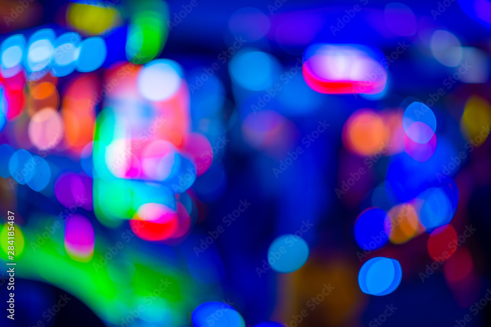Defocused colorful neon lights in arcade