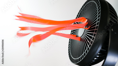 Portable electric re-chargeable house fan with blowing ribbon tassels. photo