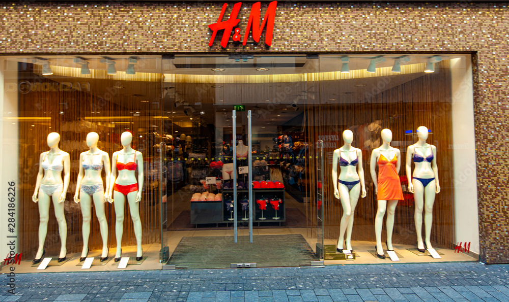 Detail of the H and M store in Cologne, Germany. H and M is a Swedish  multinational retail-clothing company founded at 1947. Stock Photo | Adobe  Stock