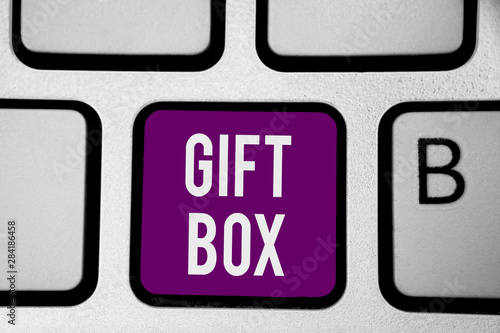 Writing note showing Gift Box. Business photo showcasing A small cointainer with designs capable of handling presents Keyboard purple key Intention computer computing reflection document photo