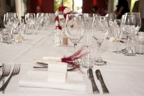 Formal table laid out for a wedding with white table cloth