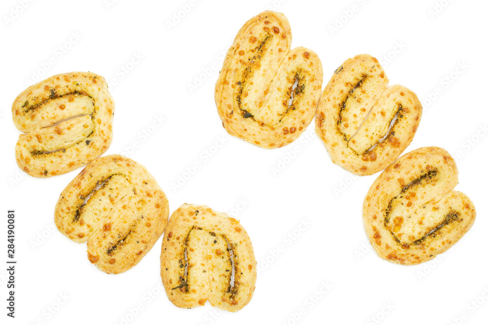 Group of six whole savory cheese palmier flatlay isolated on white background