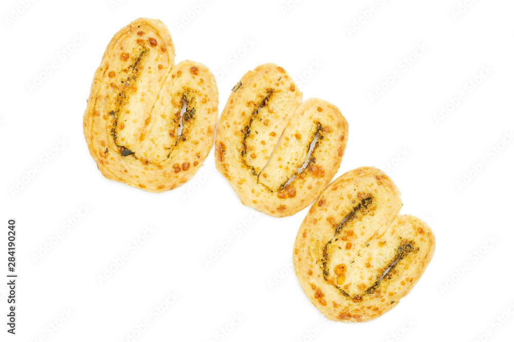 Group of three whole baked savory cheese palmier flatlay isolated on white background