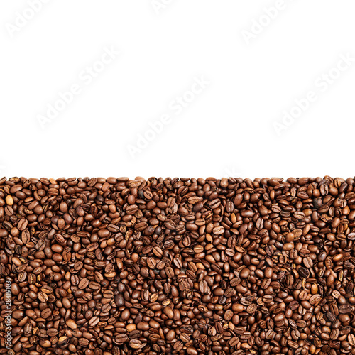 Roasted Coffee beans in bottom part of image and negative space on top