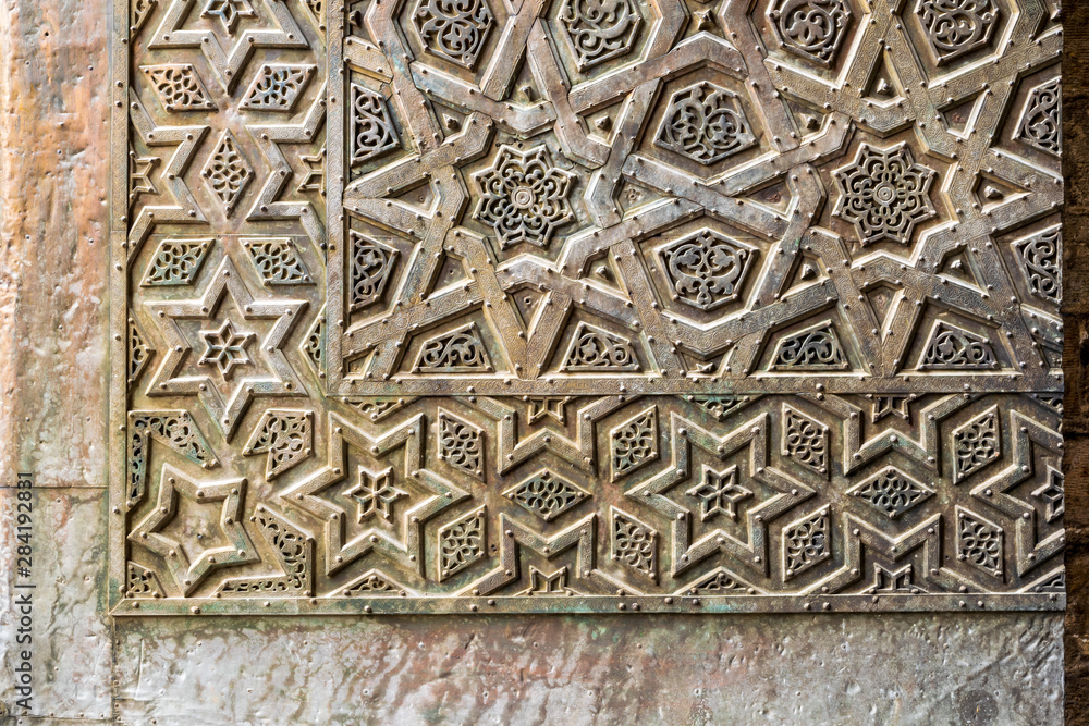 Ornaments of the bronze-plate door of an old mosque