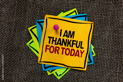 Text sign showing I Am Thankful For Today. Conceptual photo Grateful about living one more day Philosophy Black bordered different color sticky note stick together with pin on jute sack