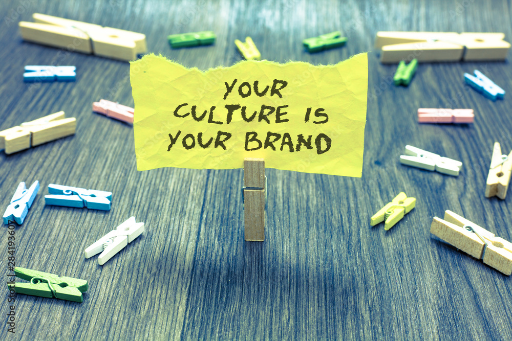 Handwriting text Your Culture Is Your Brand. Concept meaning Knowledge Experiences are a presentation card Paperclip hold written torn page many clips laid on bluish wooden floor