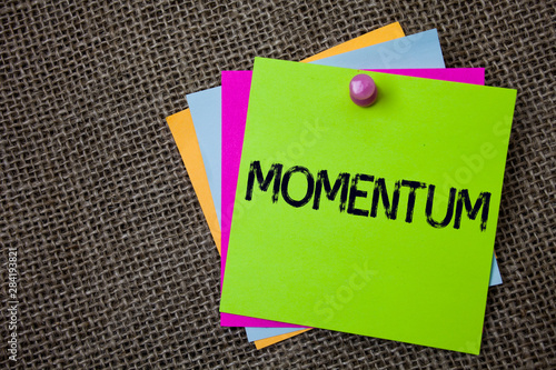 Handwriting text writing Momentum. Concept meaning Quantity motion in moving body Product of mass and velocity Sticky cards board pinned muliple colours remember idea jute background photo