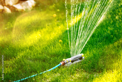 Close up details of automatic lawn circular sprinkler. Details of irrigation