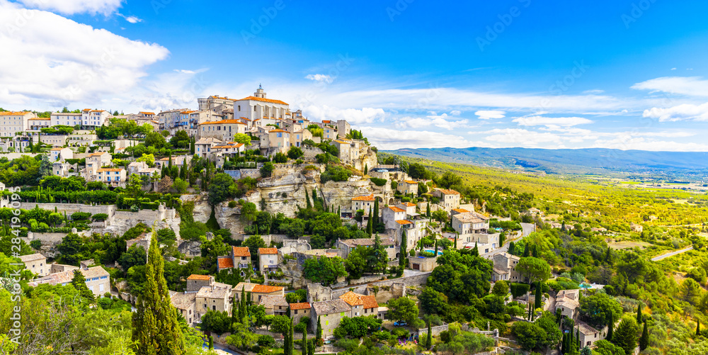 View of Gordes, a small medieval town in Provence, France. A view of the ledges of the roof of this beautiful village and landscape.