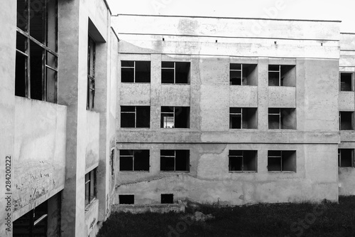 Abandoned windows. old gray wall