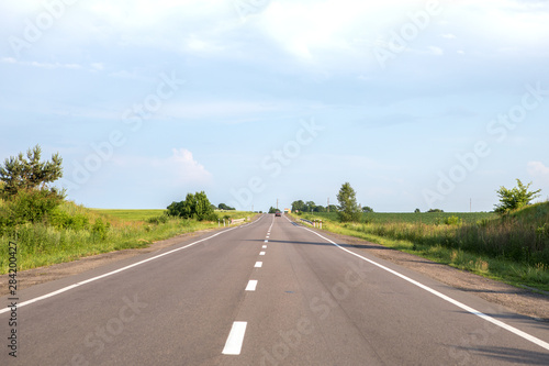 speed highway through the field. asphalt-paved road © Ruslan Ivantsov
