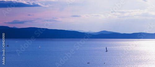 Recreational boating on Lake Champlain in Burlington, Vermont, USA at dusk. photo