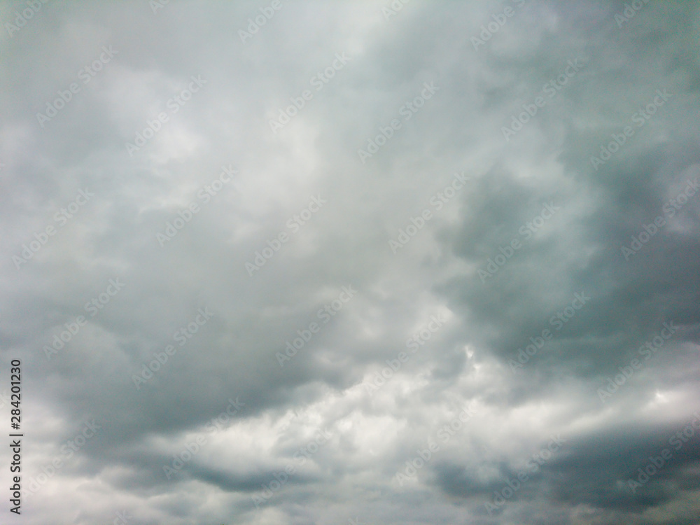 Dramatic dark clouds moody grey sky clouds scape natural background. Heavy stormy sky epic air view