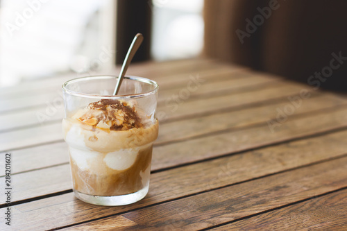 Delicious affogato in glass on a wooden table