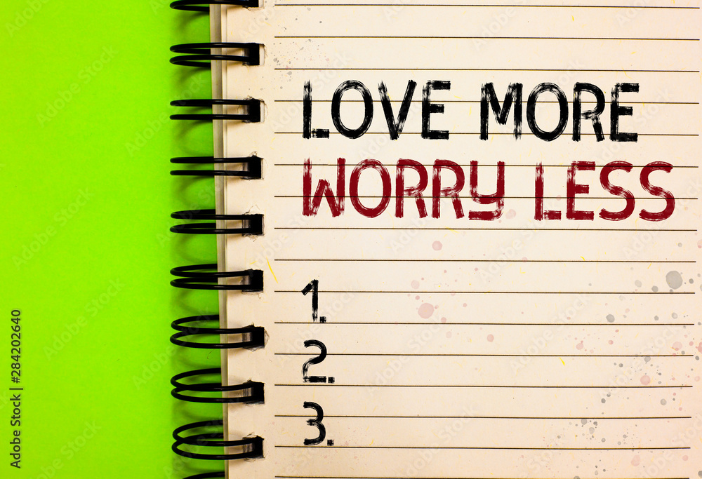 Word writing text Love More Worry Less. Business concept for Have a good attitude motivation be lovable enjoy life Written black and red text and number on white notepad green background Word writing text Love More Worry Less. Business concept for Have a good attitude motivation be lovable enjoy life Written black and red text and number on white notepad green background