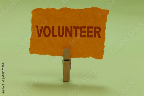 Writing note showing Volunteer. Business photo showcasing Volunteering individual for greater social cause serving others Nice lime colour grey shadow art work board important clip paperclip photo