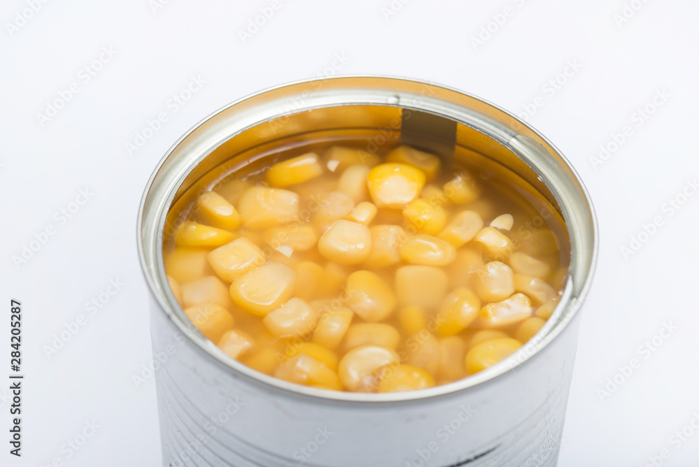 opened kernel sweet corn in brine canned , canned food isolated on white background opened kernel sweet corn in brine canned , canned food isolated on white background