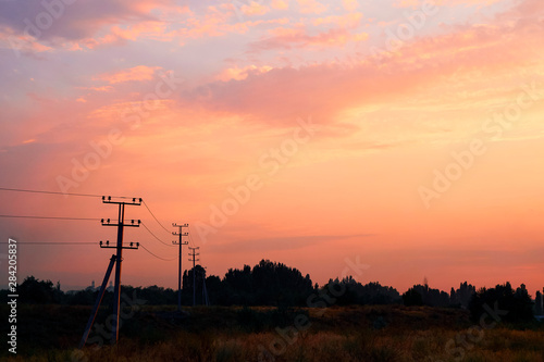 Light through the clouds against the backdrop of an exciting, vibrant sky at sunset. panorama, nature composition, nature background picture, copy space