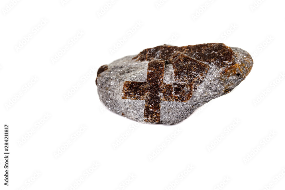 macro mineral stone Staurolite on a white background macro mineral stone Staurolite on a white background