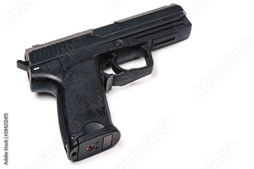 Used black metal 9mm pistol gun on white background