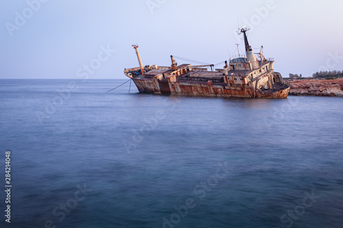 Fototapeta Naklejka Na Ścianę i Meble -  Abandoned rusty ship Edro III near Pegeia, Paphos, Cyprus at sunrise