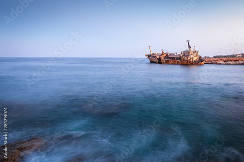 Fototapeta Naklejka Na Ścianę i Meble -  Abandoned rusty ship Edro III near Pegeia, Paphos, Cyprus at sunrise