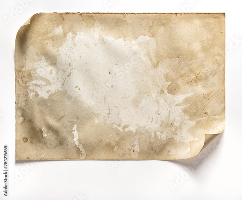Fotografia Used worn paper sheet curled corners white background