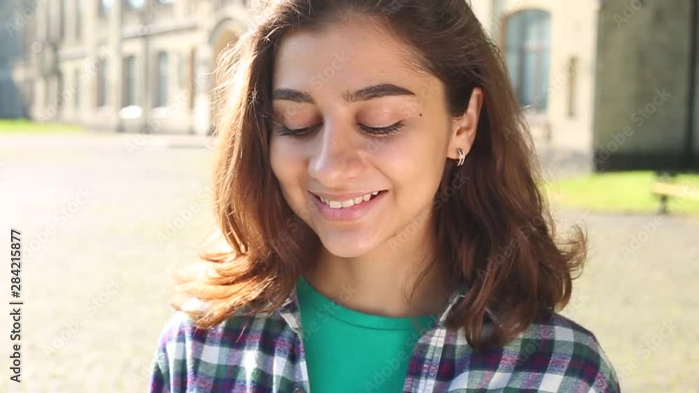 Portrait of a smiling Indian girl. Face of a happy mixed race young woman. Closeup of a beautiful brunette. Muslim female. Portrait of a smiling Indian girl. Face of a happy mixed race young woman. Closeup of a beautiful brunette. Muslim female.