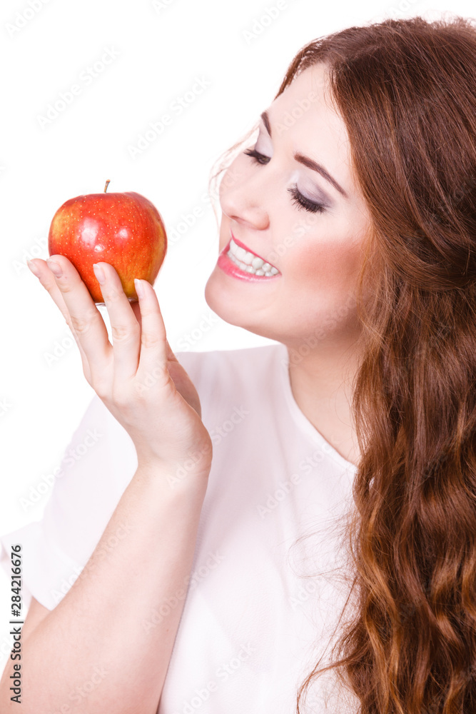 Woman holds apple fruit close to face, isolated Woman holds apple fruit close to face, isolated