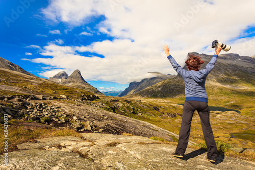 Happy tourist looking at mountains nature, Norway