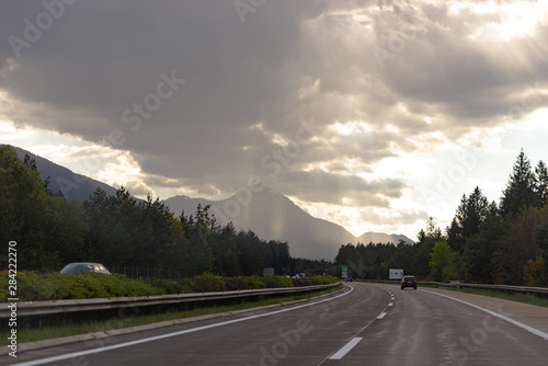 Roads Of Austria. Austrian highway with beautiful views. Wet road after rain. Photo from the car.
