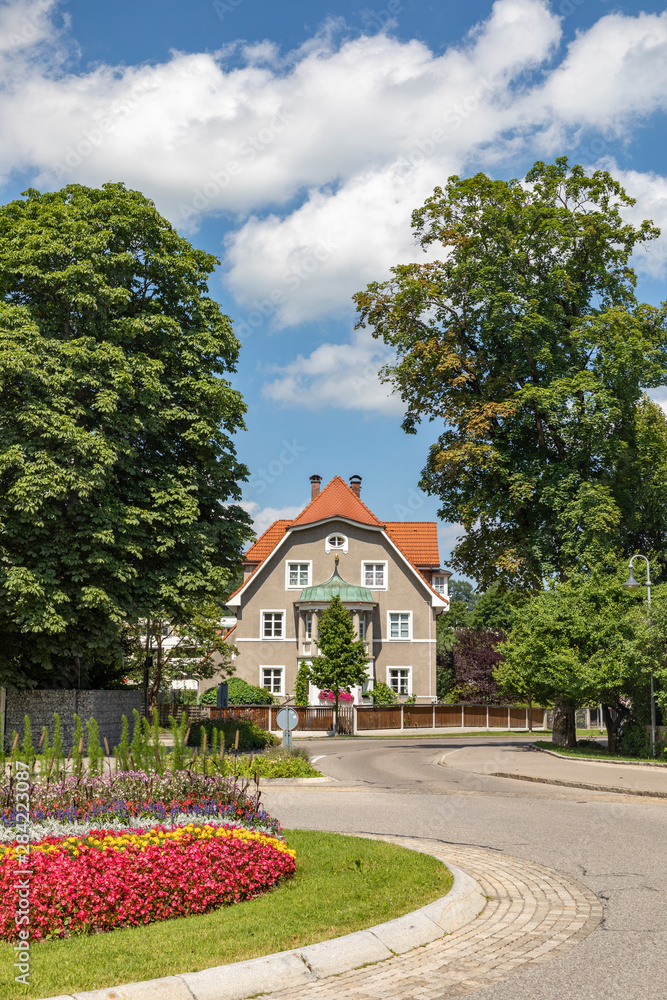 typical historic old house with road and colotful round about in Fuessen