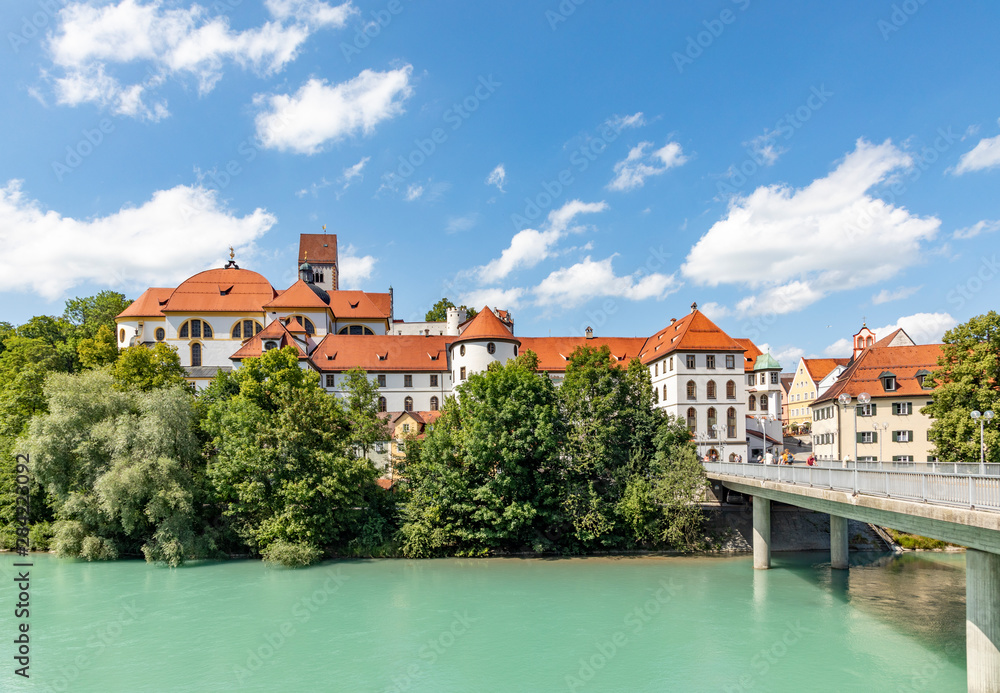 High Palace and Saint Mang monastery in Fuessen on river Lech, Germany