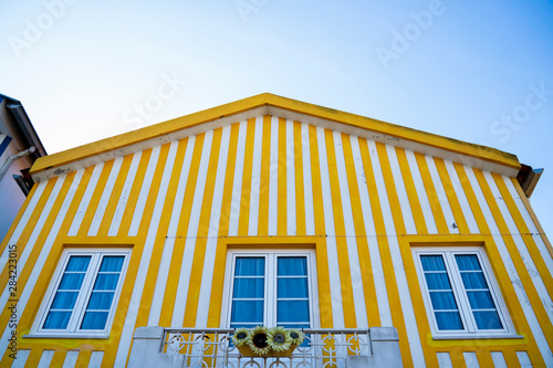 Yellow and white striped house, traditional house of Aveiro.