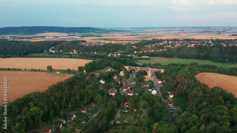 Aerial View of Old Bridge Viaduct in Green Wood Near The Village. Railroad Over Valley. Aerial View of Old Bridge Viaduct in Green Wood Near The Village. Railroad Over Valley.