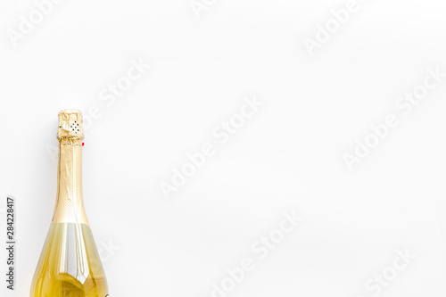 Champagne bottle for celebration on white background top view mock up