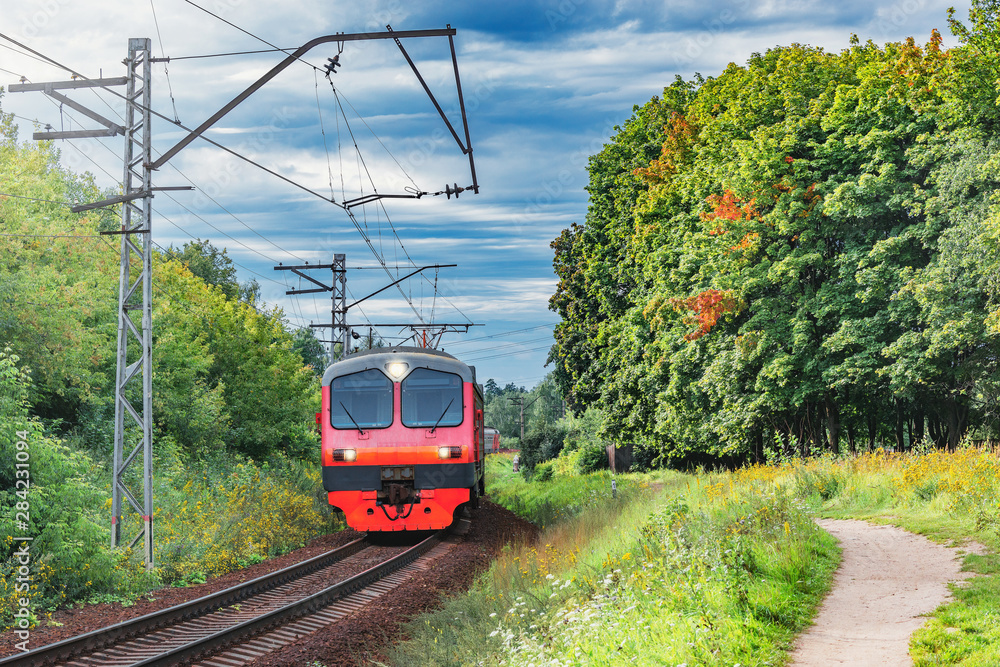 Naklejka premium Passenger train moves through countryside, Moscow region. Russia.