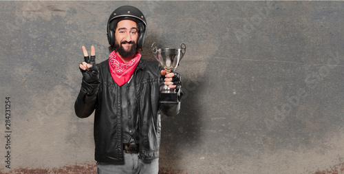 motorbike rider winnig a trophy photo