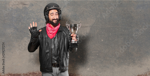 motorbike rider winnig a trophy photo