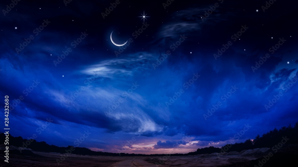 Beautiful dark fluffy cloudy sky with sun rays . Crescent moon with beautiful sunset background . Generous Ramadan . New moon. Prayer time. 