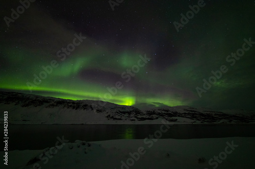 Spreading aurora over the fjord © Thomas