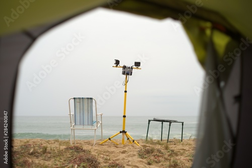View of beach through camping tent entrance photo