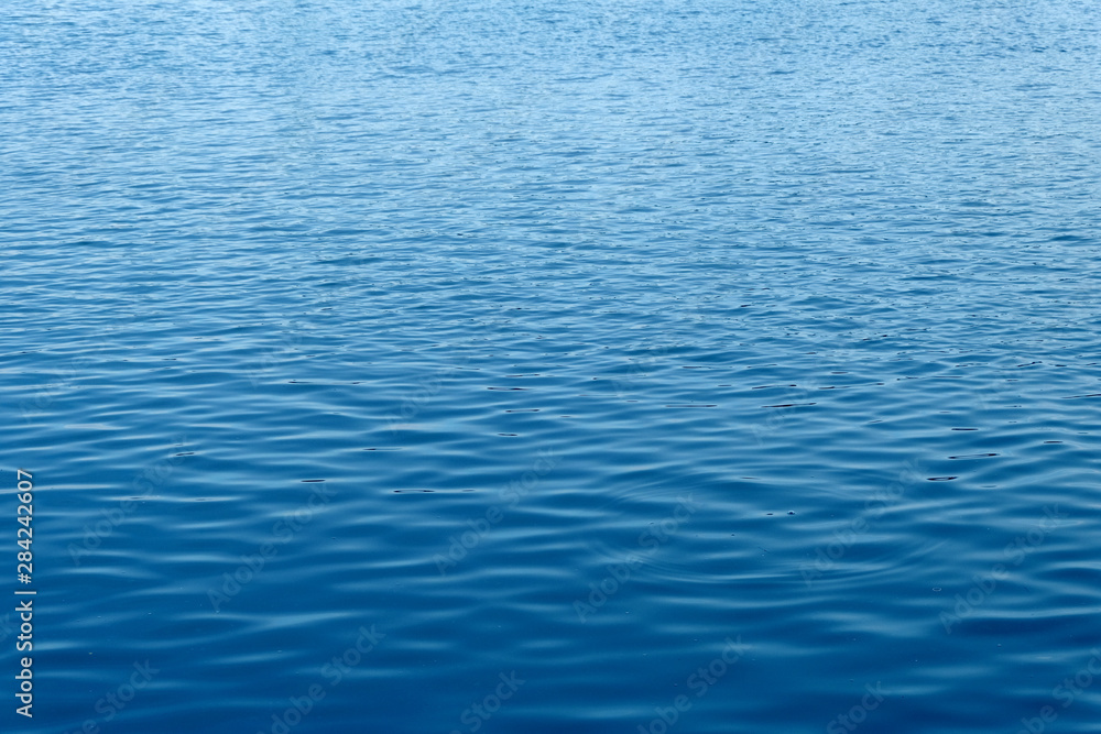 close up ocean water background , blue water ripples texture close up ocean water background , blue water ripples texture