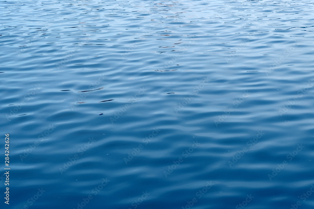close up ocean water background , blue water ripples texture close up ocean water background , blue water ripples texture